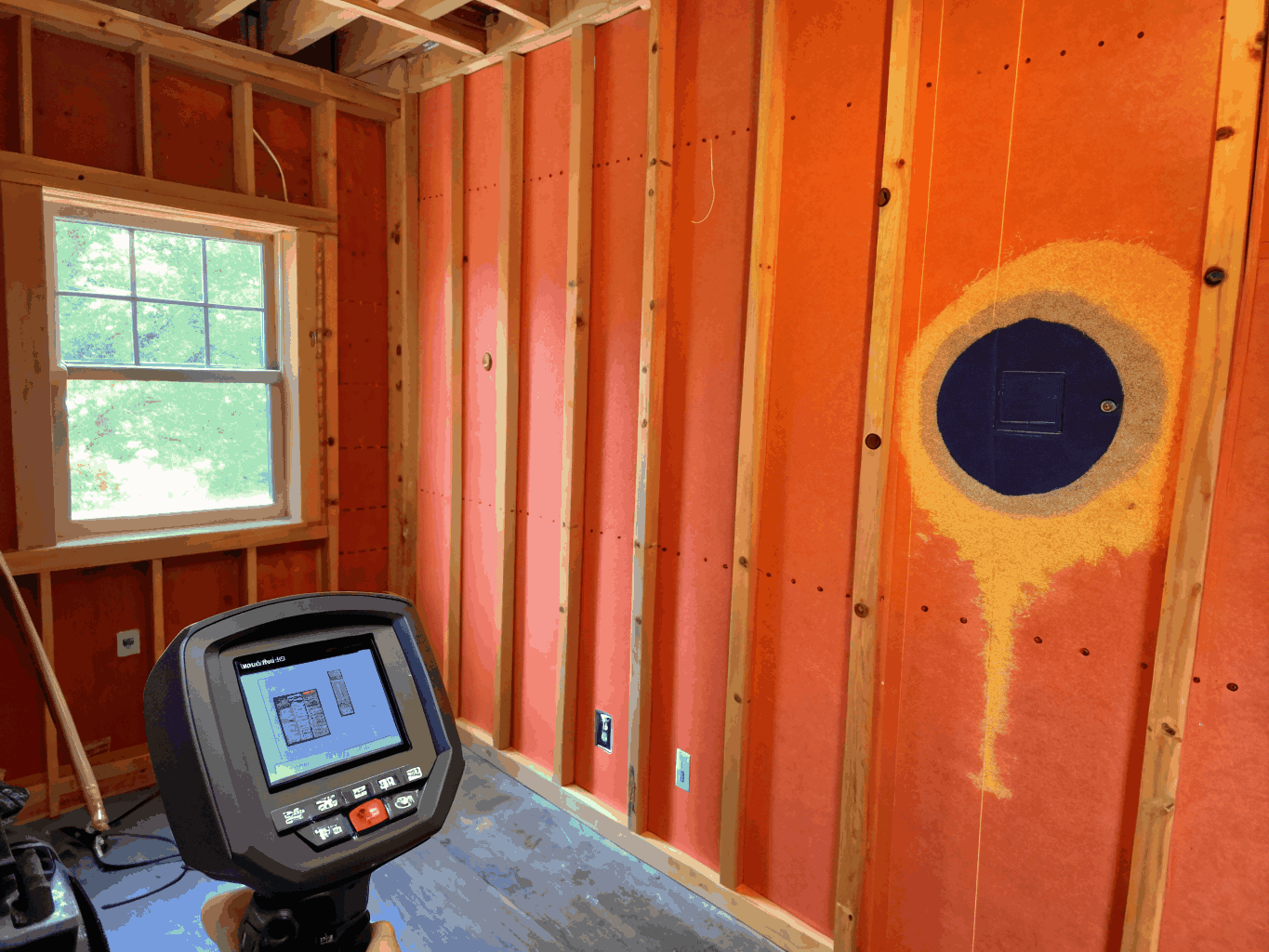 Thermal imaging camera scanning a crawl space